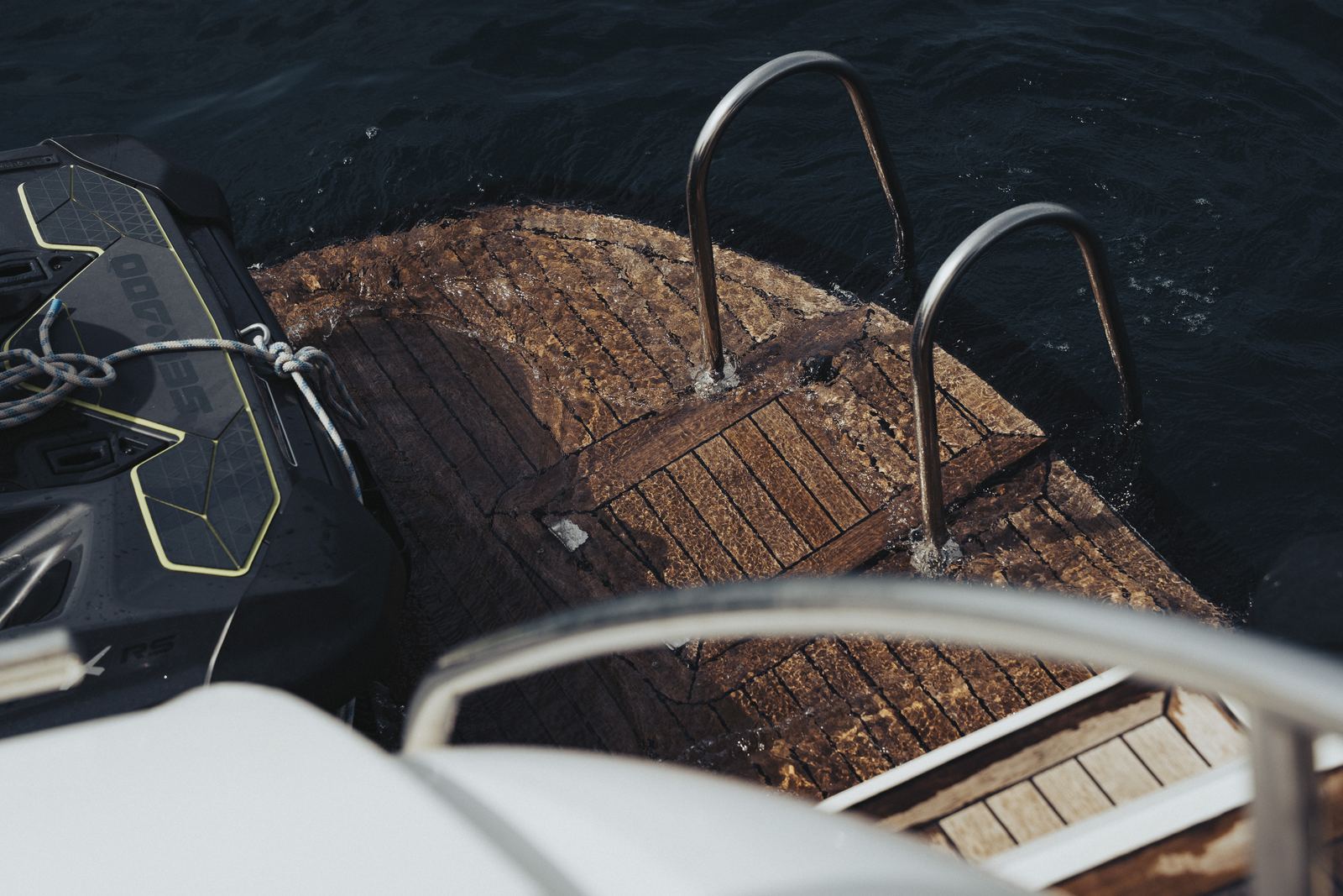 Guests swimming from a private charter boat anchored off Ibiza